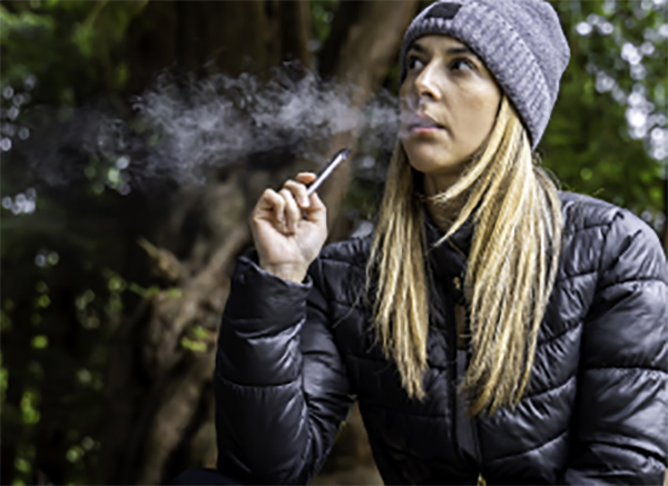Girl using JUUL
